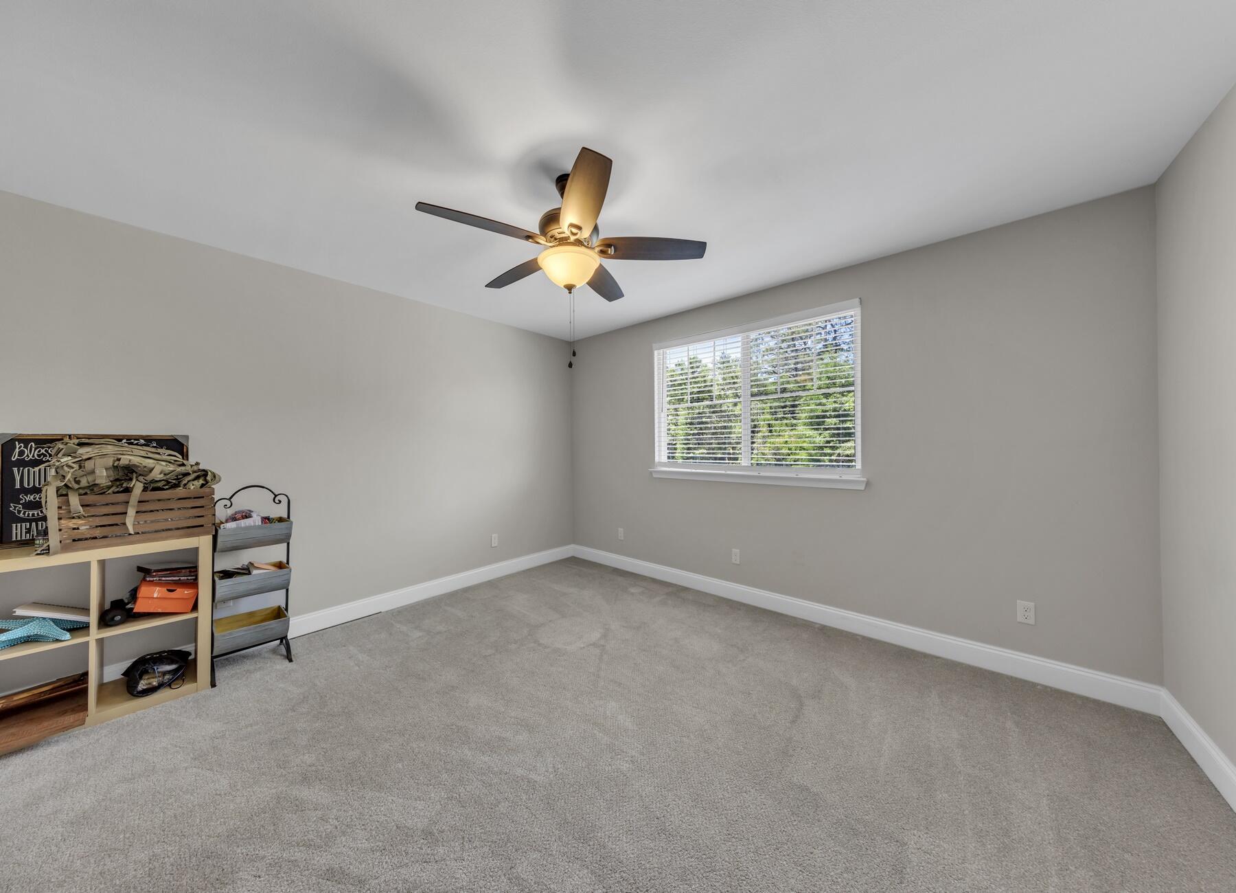 1200 French Quarter Way Fort Walton Beach, FL 32547 - Photo 24 of 45 an empty room with windows and ceiling fan