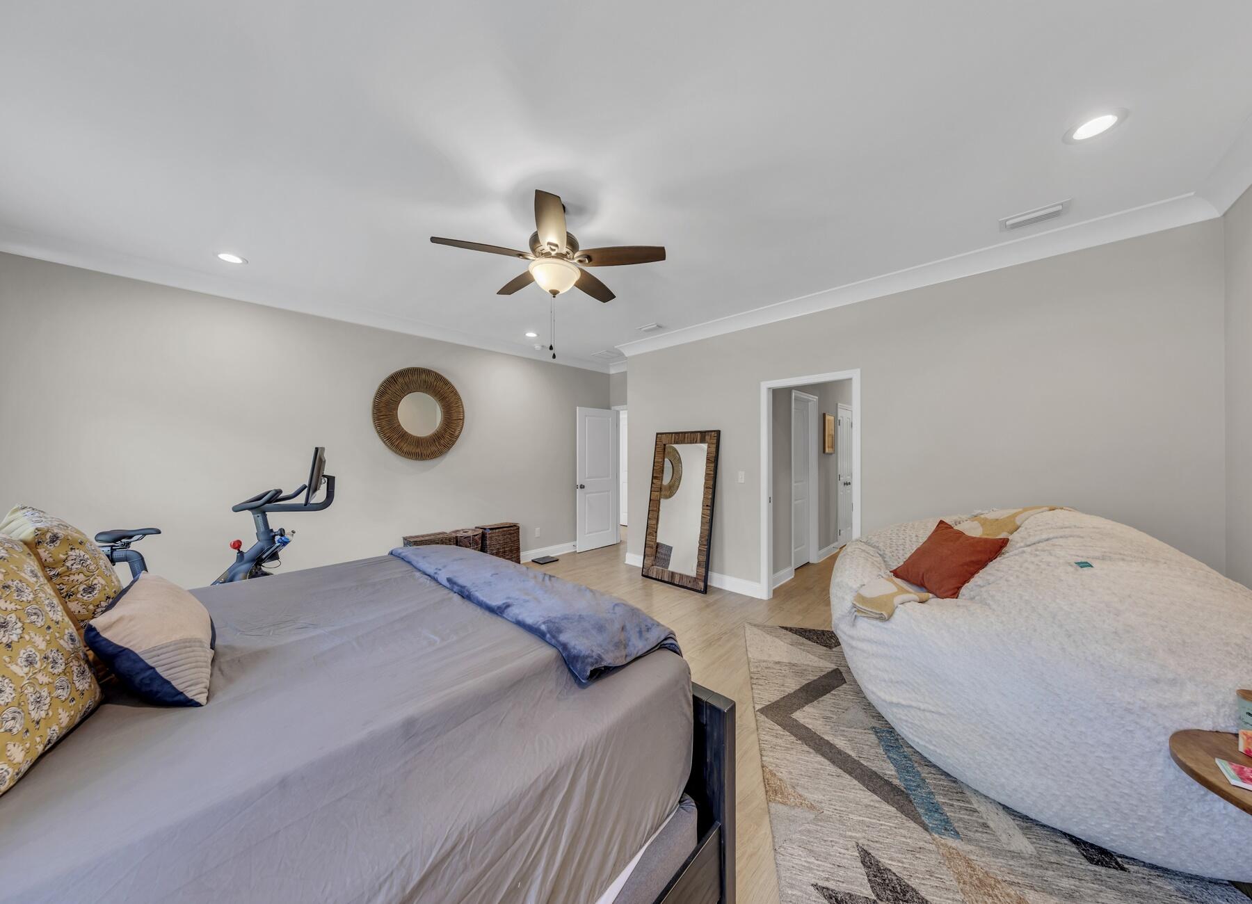1200 French Quarter Way Fort Walton Beach, FL 32547 - Photo 32 of 45 a bedroom with a bed and a chandelier