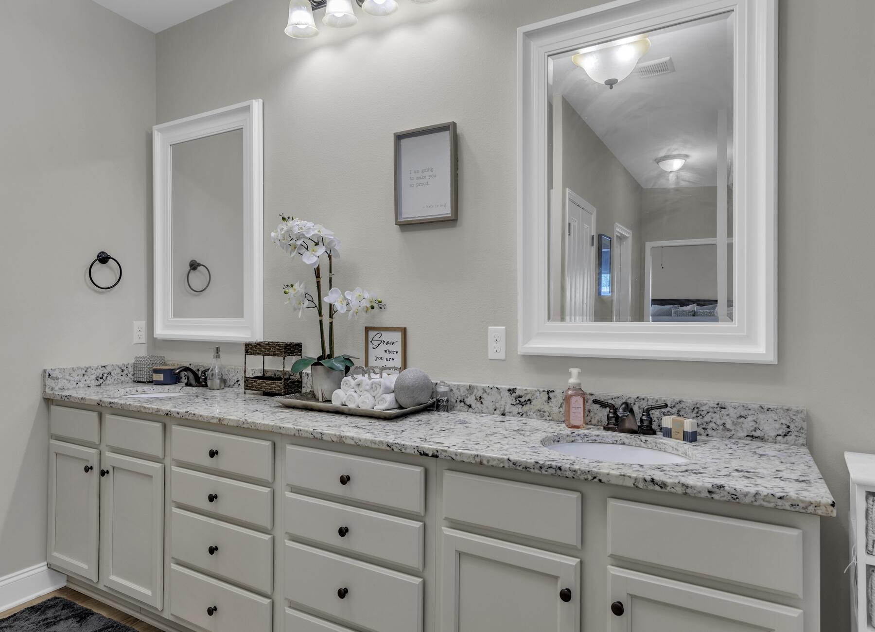 1200 French Quarter Way Fort Walton Beach, FL 32547 - Photo 35 of 45 a bathroom with a granite countertop double vanity sink and mirror
