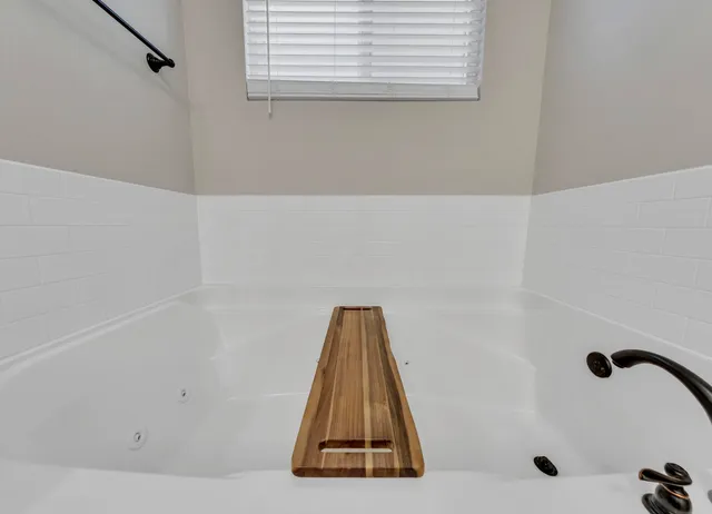 a view of a house with pool and sitting area