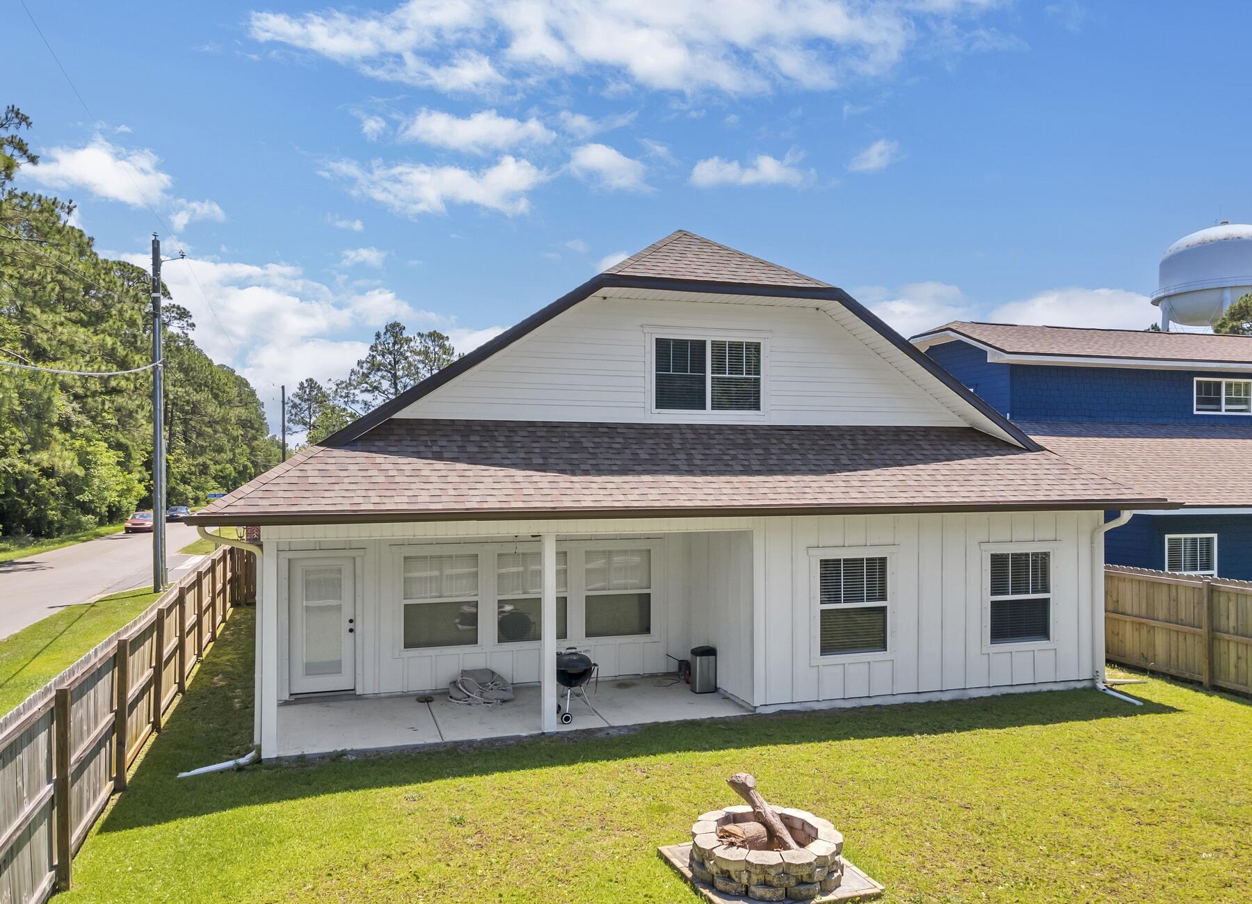 1200 French Quarter Way Fort Walton Beach, FL 32547 - Photo 43 of 45 a front view of house with yard outdoor seating and barbeque oven