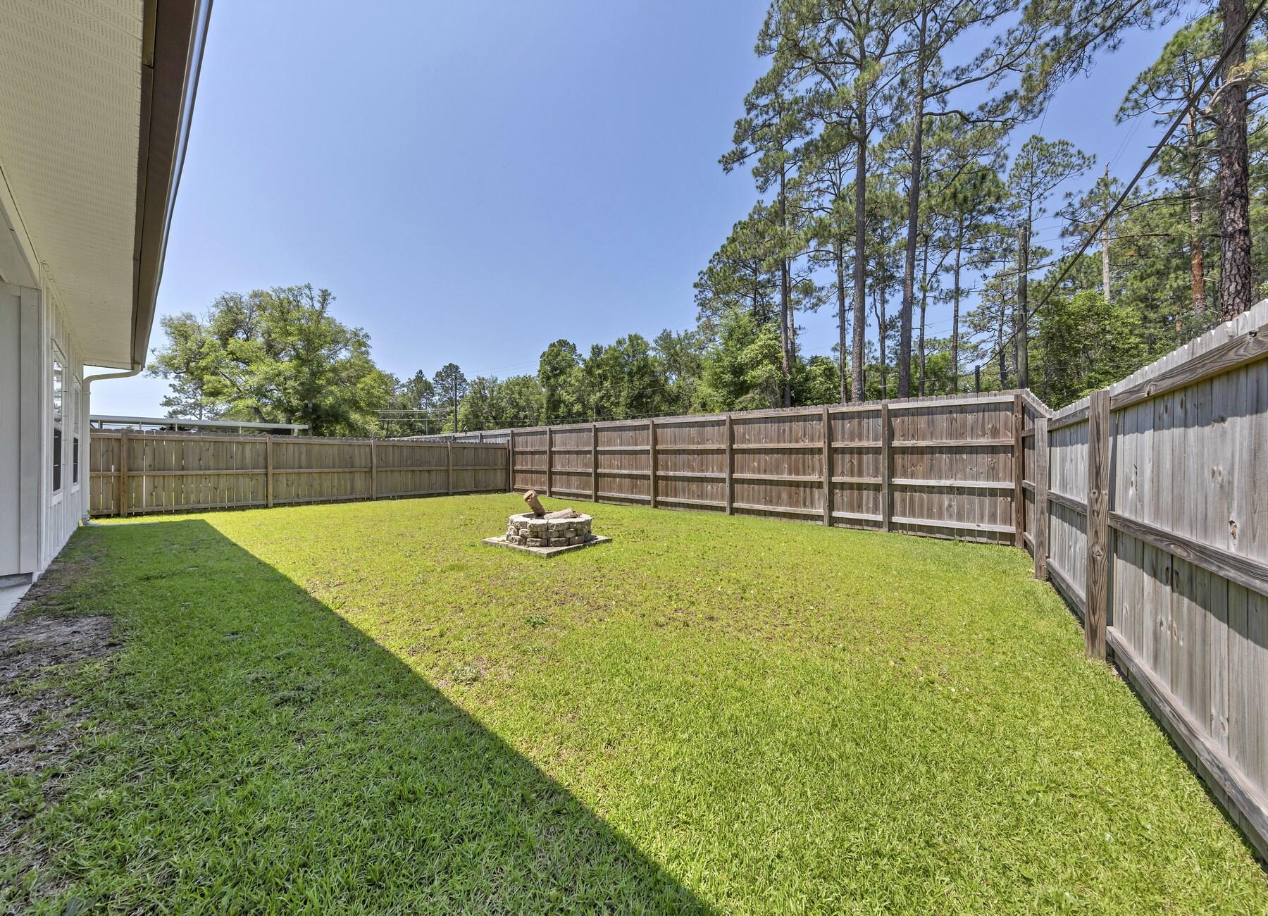 1200 French Quarter Way Fort Walton Beach, FL 32547 - Photo 44 of 45 a view of a backyard with a large tree