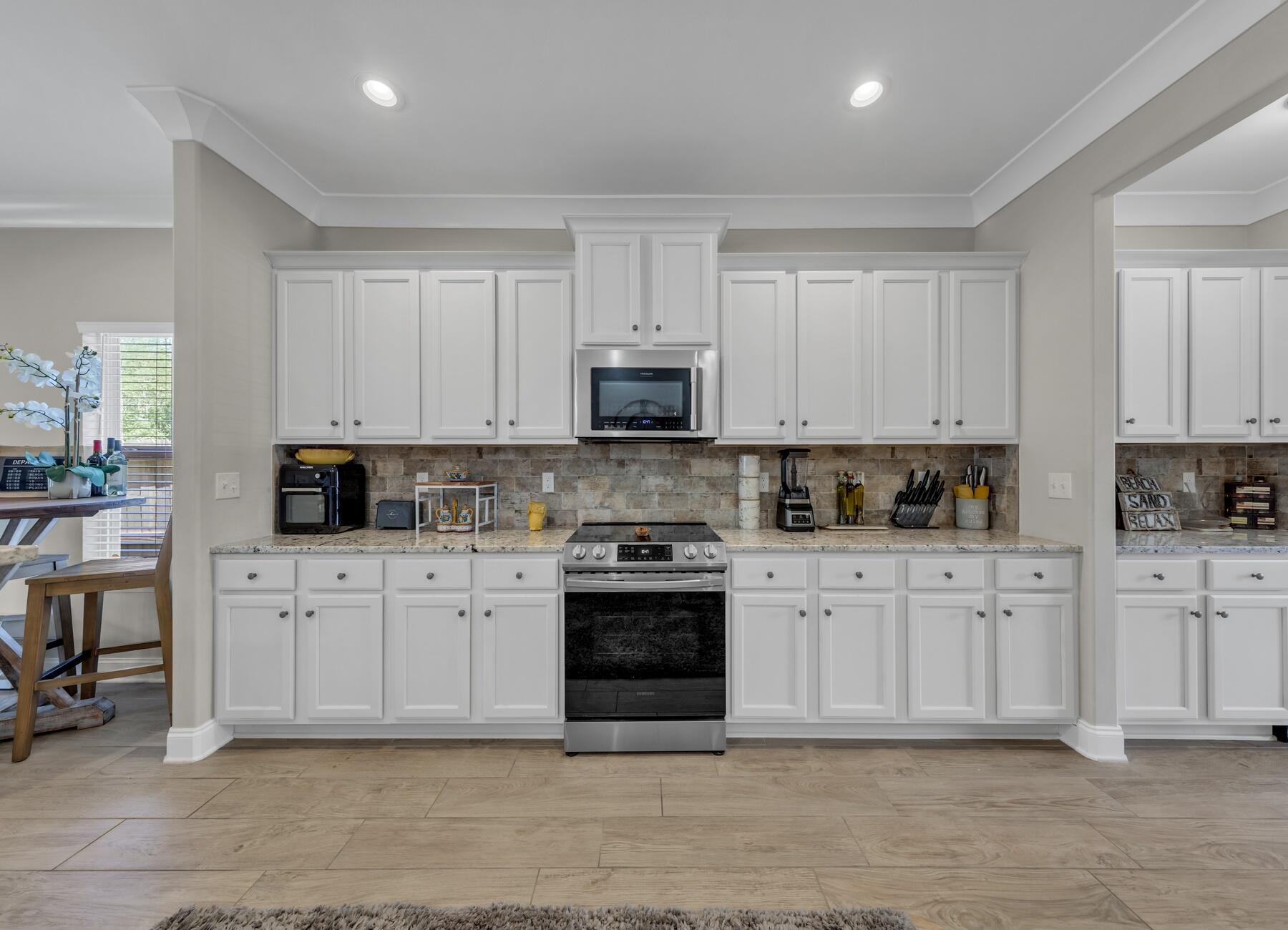 1200 French Quarter Way Fort Walton Beach, FL 32547 - Photo 8 of 45 a white kitchen with granite countertop stainless steel appliances