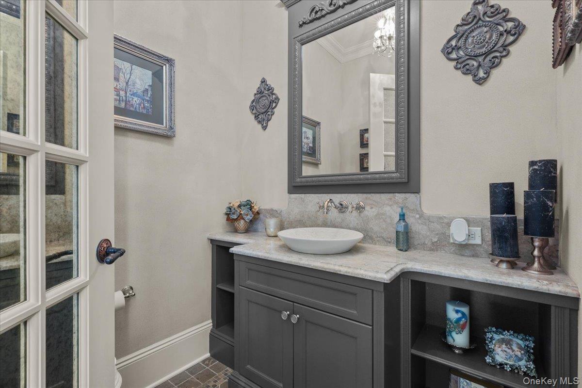 135 Pines Bridge Road Katonah, NY 10536 - Photo 23 of 40 a bathroom with a sink and a mirror