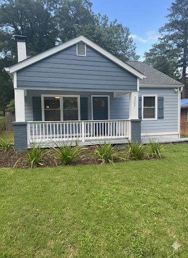 2507 Ryne Street Northwest Atlanta, GA 30318 - Photo 1 of 15 a view of a house with a yard and deck