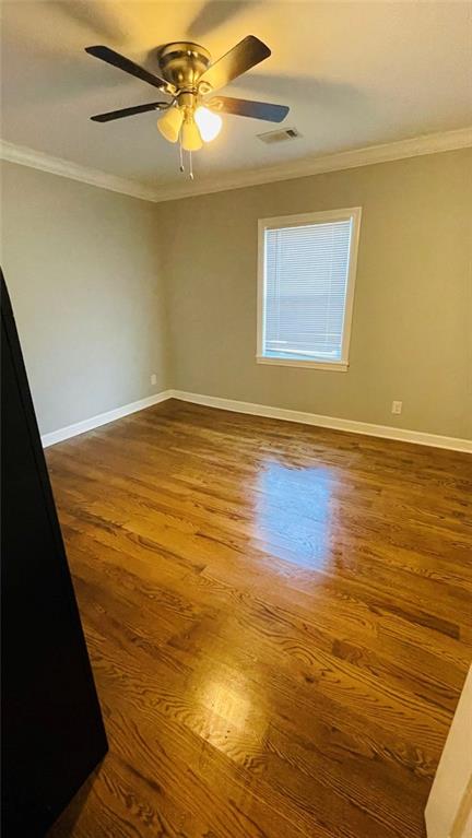 2507 Ryne Street Northwest Atlanta, GA 30318 - Photo 14 of 15 a view of empty room with wooden floor and fan