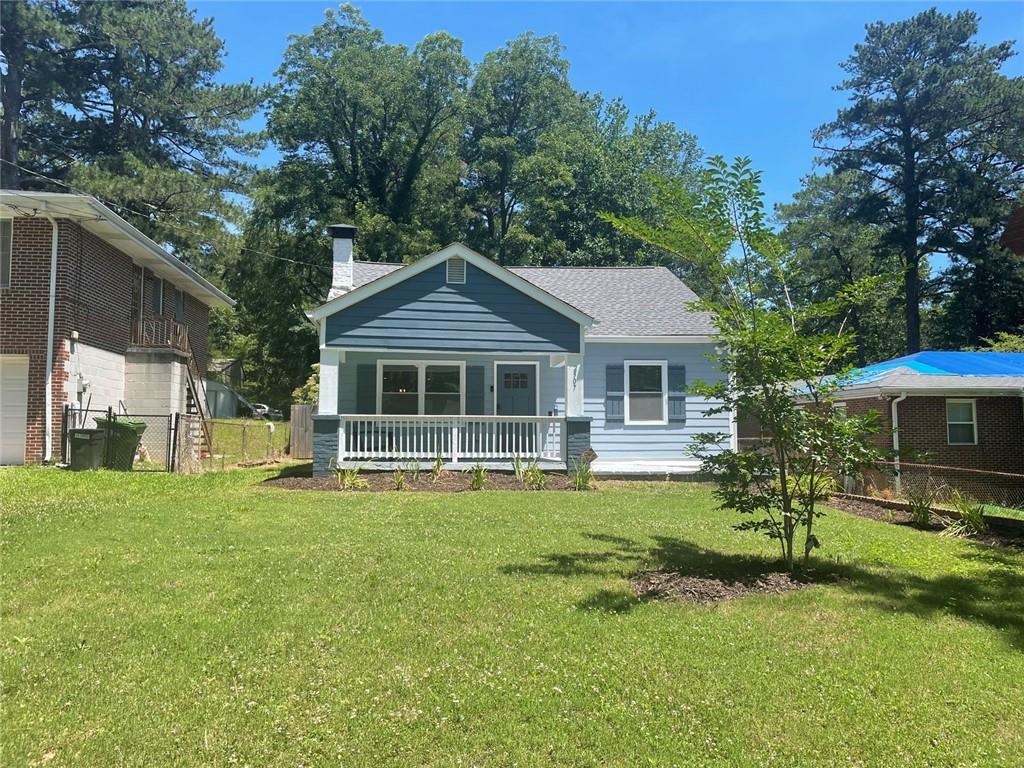 2507 Ryne Street Northwest Atlanta, GA 30318 - Photo 2 of 15 a front view of a house with a garden