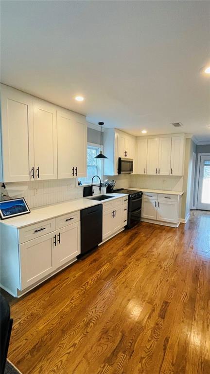 2507 Ryne Street Northwest Atlanta, GA 30318 - Photo 7 of 15 a large kitchen with a stove a sink dishwasher and a refrigerator