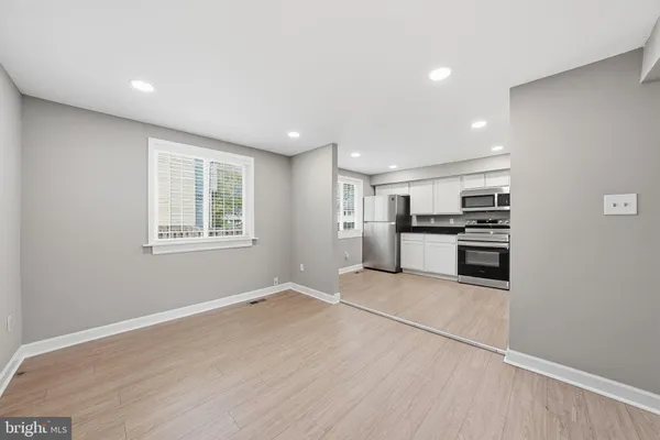 a view of kitchen with wooden floor and window
