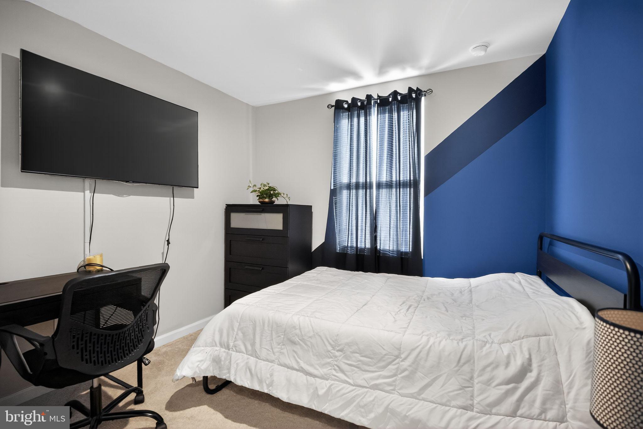 37 Riley Street Williamstown, NJ 08094 - Photo 11 of 15 a bedroom with a bed and a flat screen tv