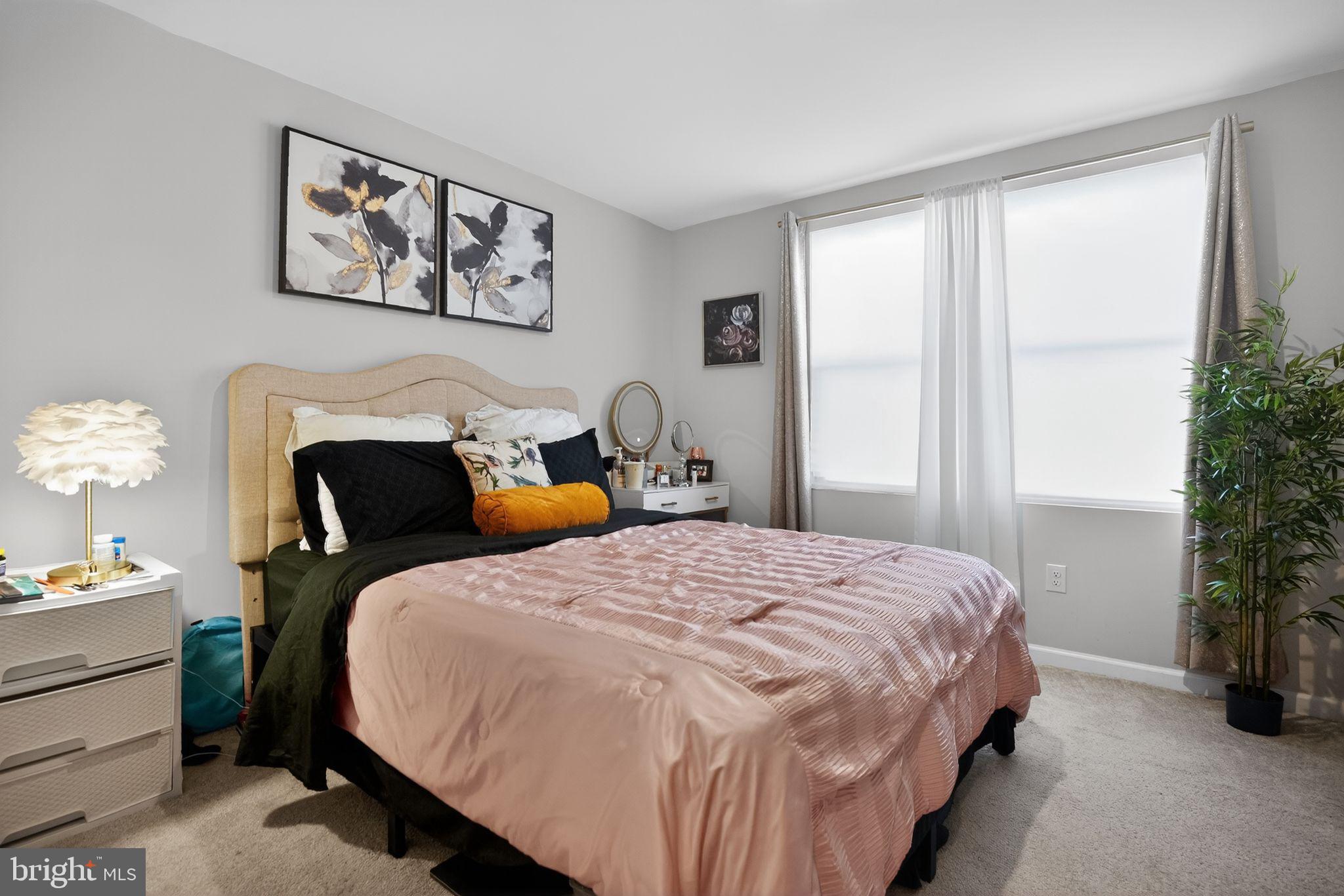 37 Riley Street Williamstown, NJ 08094 - Photo 13 of 15 a bedroom with a bed and a potted plant