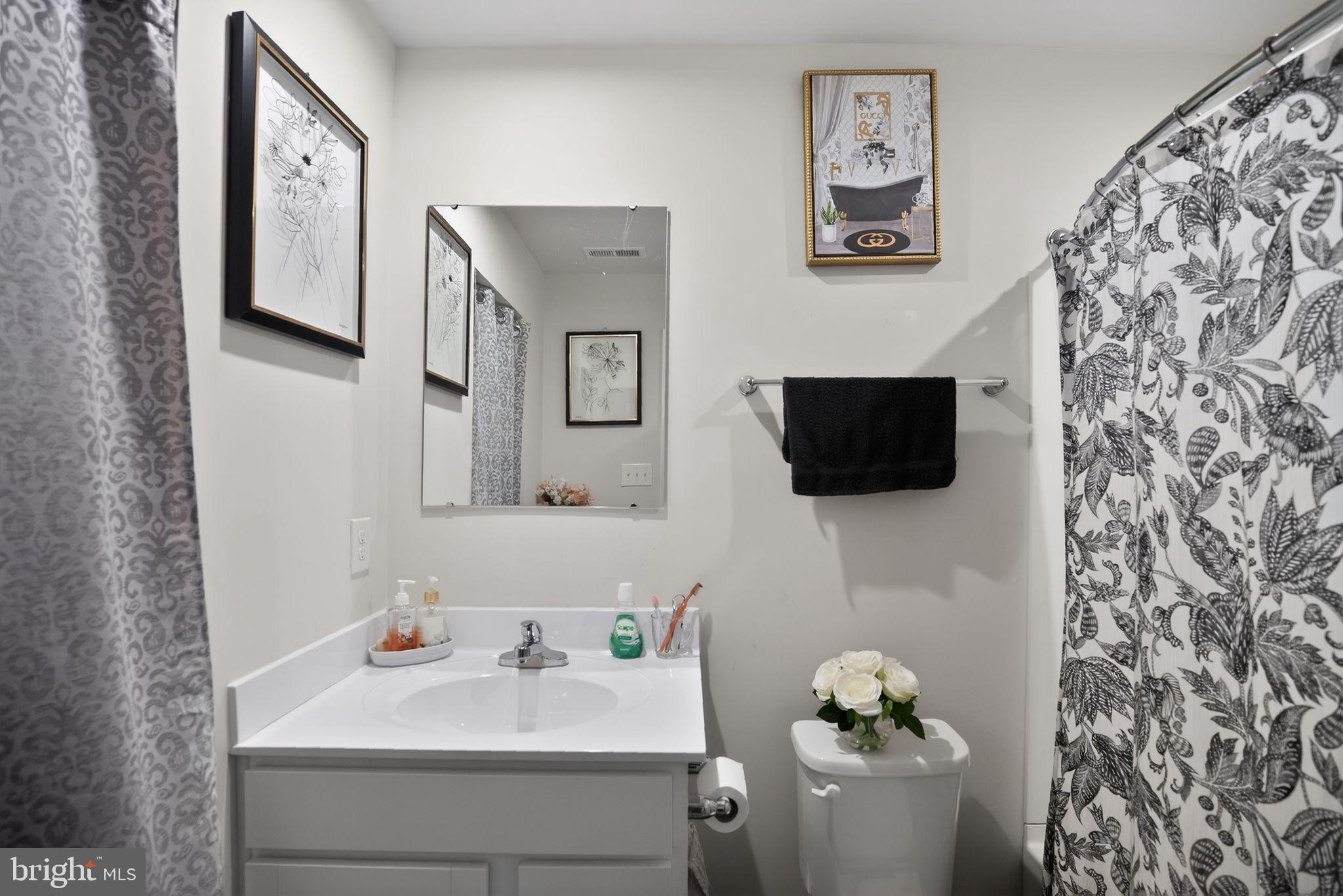 37 Riley Street Williamstown, NJ 08094 - Photo 14 of 15 a bathroom with a sink toilet and mirror