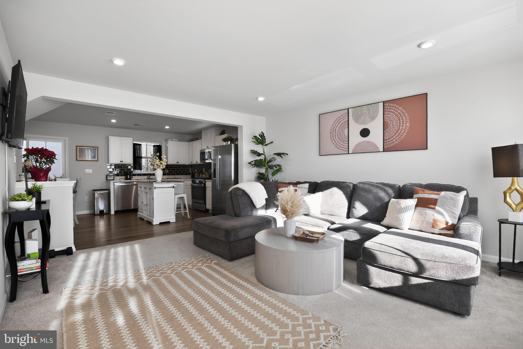 37 Riley Street Williamstown, NJ 08094 - Photo 5 of 15 a living room with furniture and kitchen view