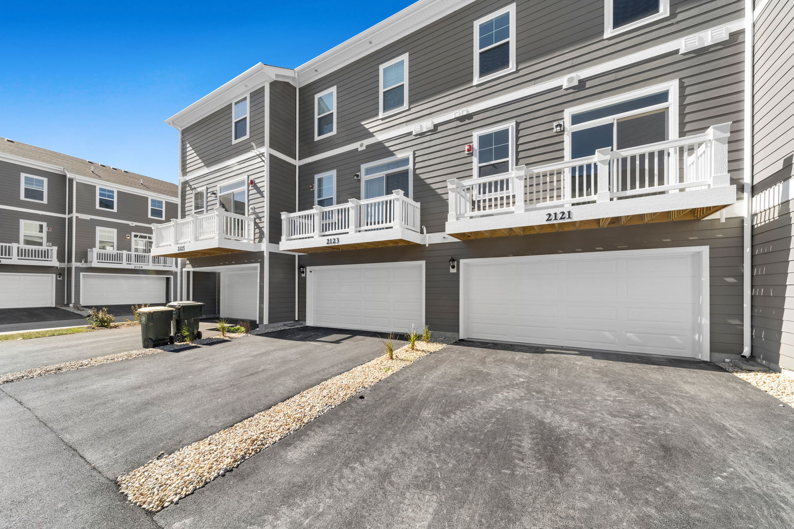 2121 Yellowstone Boulevard, Unit 2121 Mundelein, IL 60060 - Photo 1 of 10 a view of a building with many windows