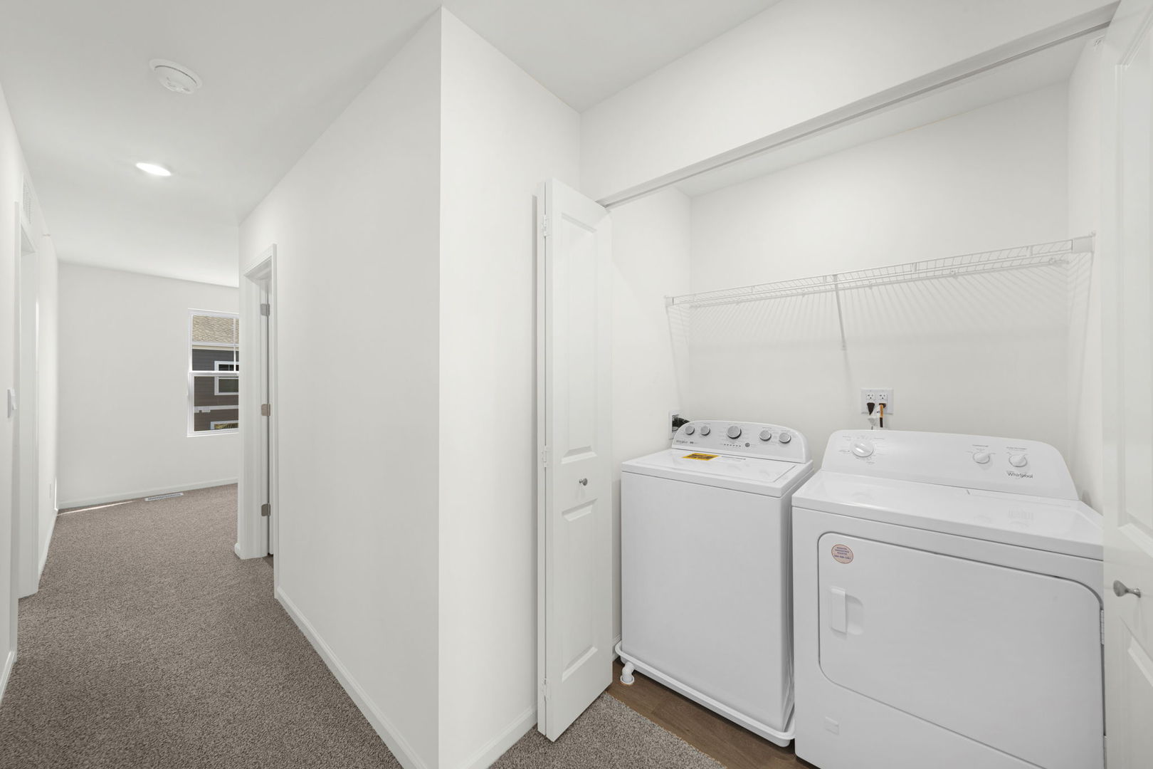 2121 Yellowstone Boulevard, Unit 2121 Mundelein, IL 60060 - Photo 10 of 10 a view of storage and utility room with washer and dryer