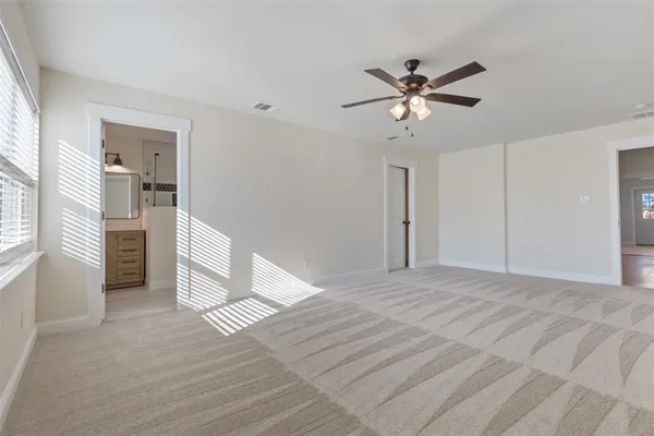 a bathroom with a shower a sink and a mirror