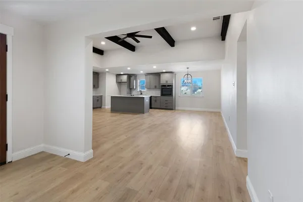 a view of a kitchen with a sink and microwave