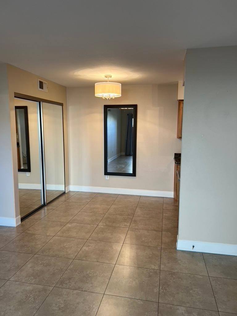 5877 North Granite Reef Road Scottsdale, AZ 85250 - Photo 3 of 10 a view of an empty room with cabinet and mirror