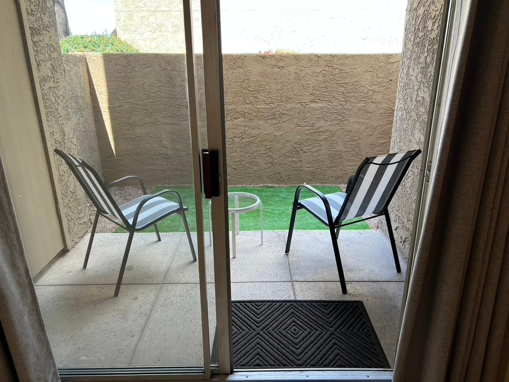 5877 North Granite Reef Road Scottsdale, AZ 85250 - Photo 6 of 10 a view of a balcony with chair and table