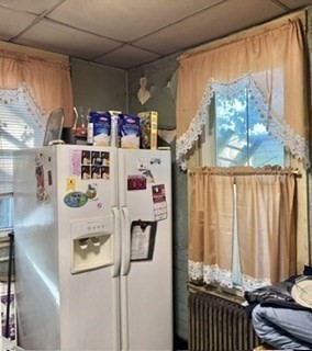 495 Warren Street Boston, MA 02121 - Photo 14 of 25 a room with lots of different colored cloths