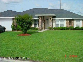 2337 Mallory Hills Road Jacksonville, FL 32221 - Photo 1 of 1 a front view of a house with a yard and garage