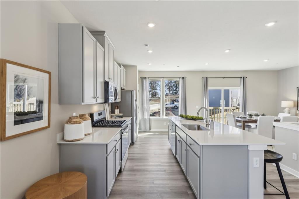 151 River Rdg Drive Moon Township, PA 15108 - Photo 11 of 23 a large white kitchen with a large window and stainless steel appliances