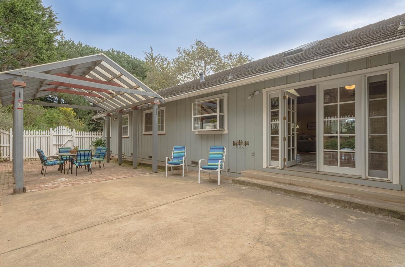 18191 Berta Canyon Road Salinas, CA 93907 - Photo 16 of 36 a view of a patio with table and chairs and floor to ceiling window