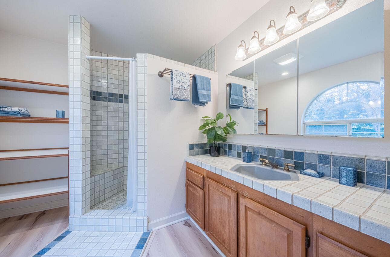 18191 Berta Canyon Road Salinas, CA 93907 - Photo 22 of 36 a bathroom with a sink and a mirror