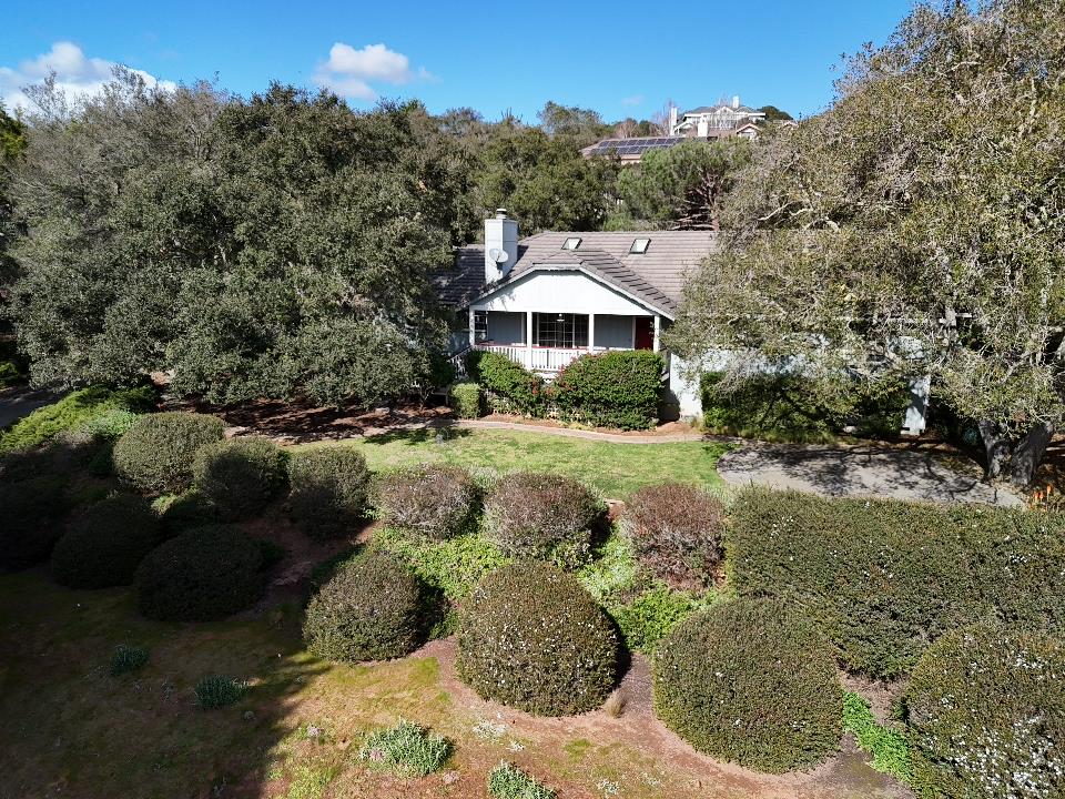 18191 Berta Canyon Road Salinas, CA 93907 - Photo 8 of 36 a view of a garden with a house in the background