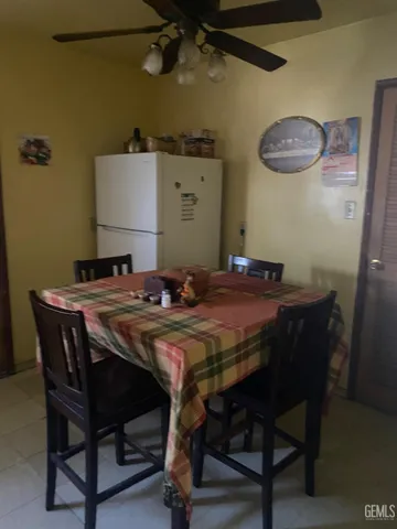 a dining room with a table and chairs