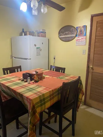 a dining room with a table and chairs