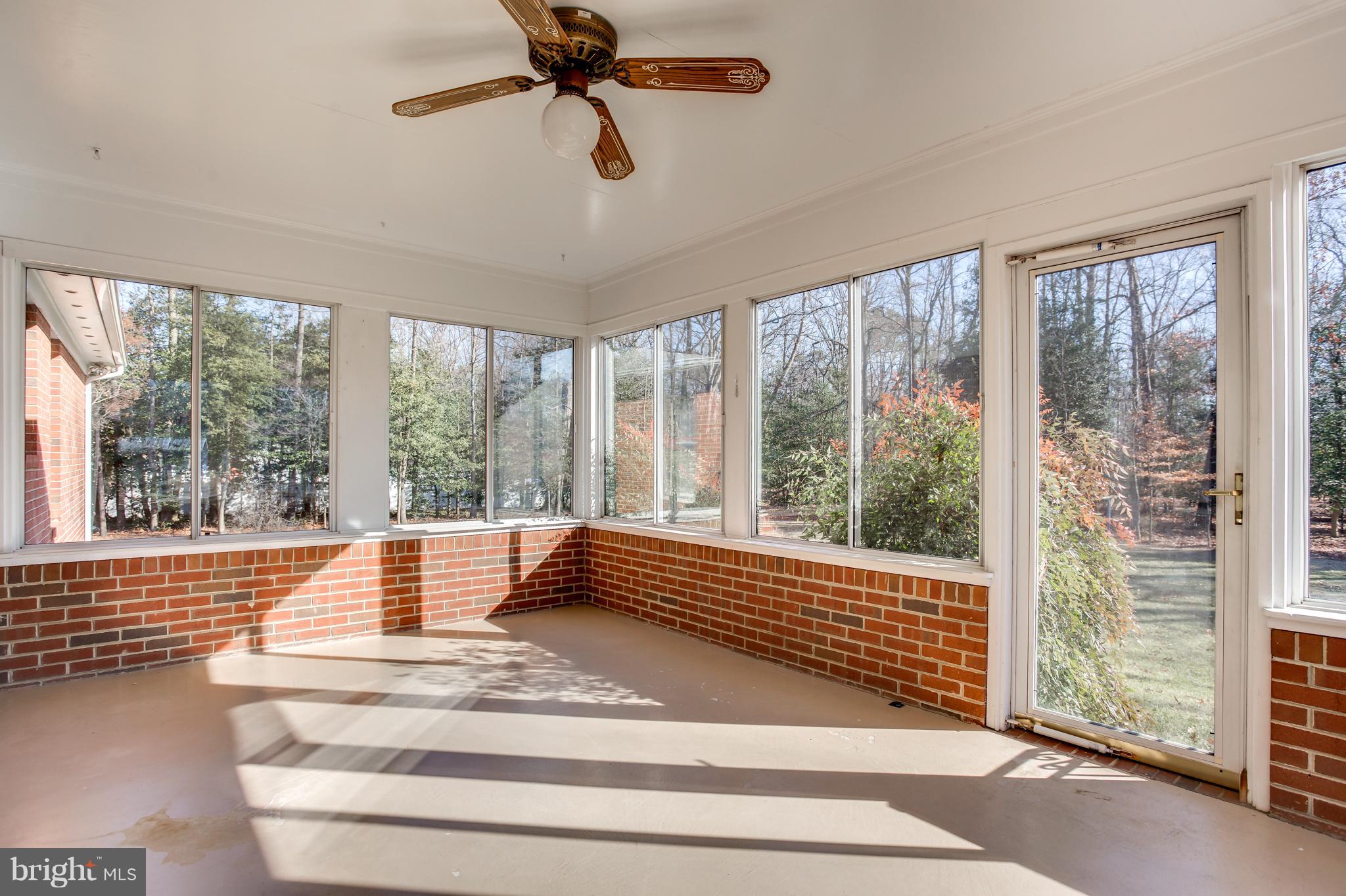 4950 Lansdowne Road Fredericksburg, VA 22408 - Photo 14 of 29 Sunroom opens to back yard and woods.