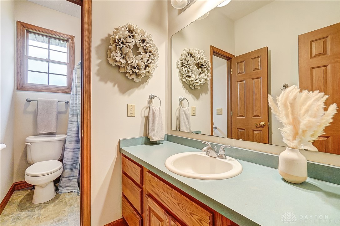 1540 Jasper Road Xenia, OH 45385 - Photo 36 of 91 This bright bathroom features a spacious vanity and ample natural light, creating a refreshing atmosphere.