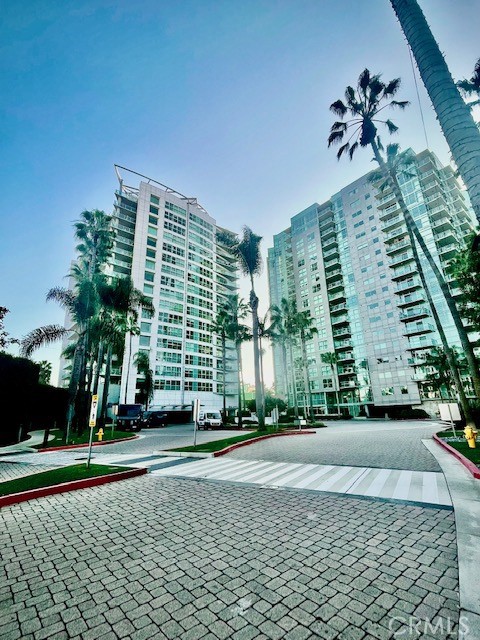 a front view of a building with a yard