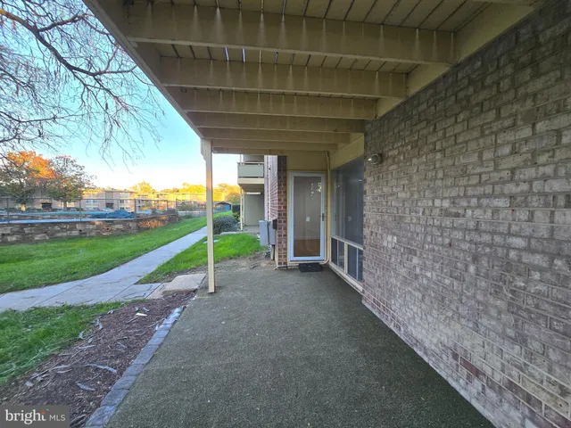 a view of a backyard with wooden fence