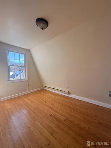a bathroom with a toilet and a bathtub