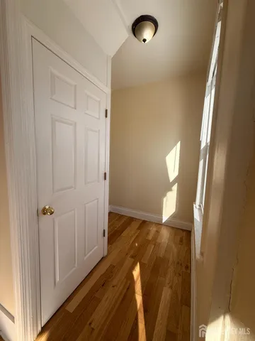 a view of entryway with wooden floor