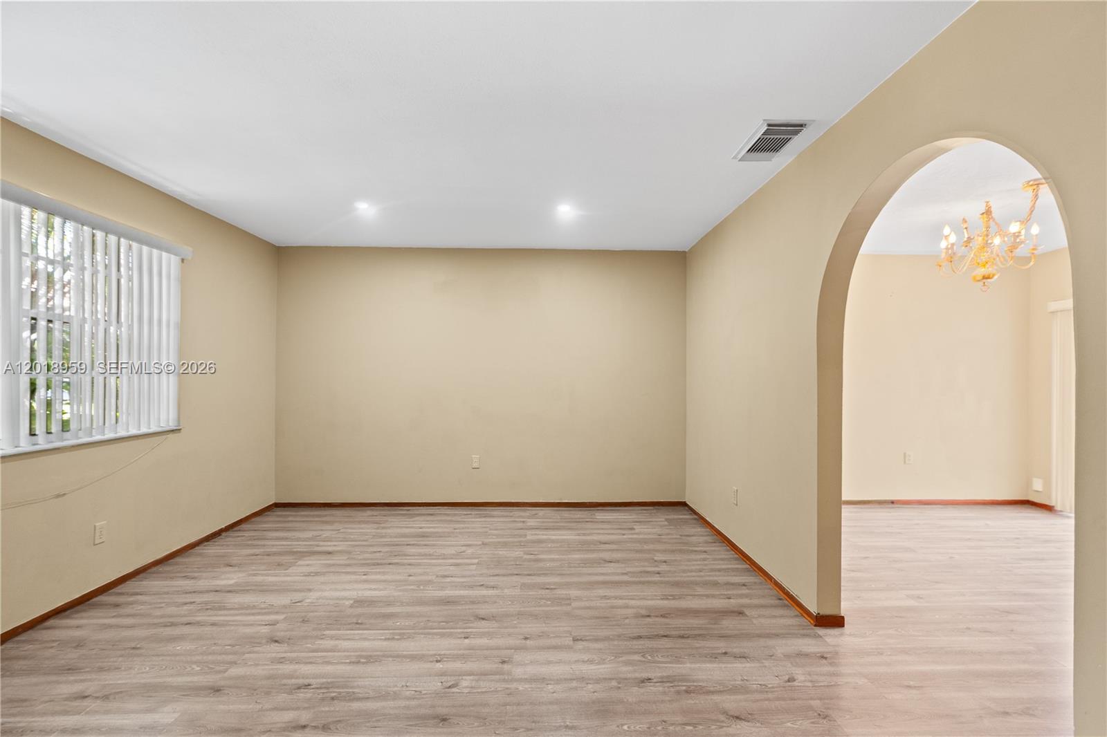 15345 Southwest 63rd Terrace Miami, FL 33193 - Photo 38 of 51 an empty room with wooden floor and windows