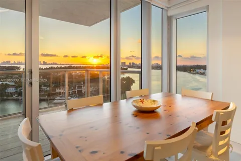 a view of a dining room with furniture and window