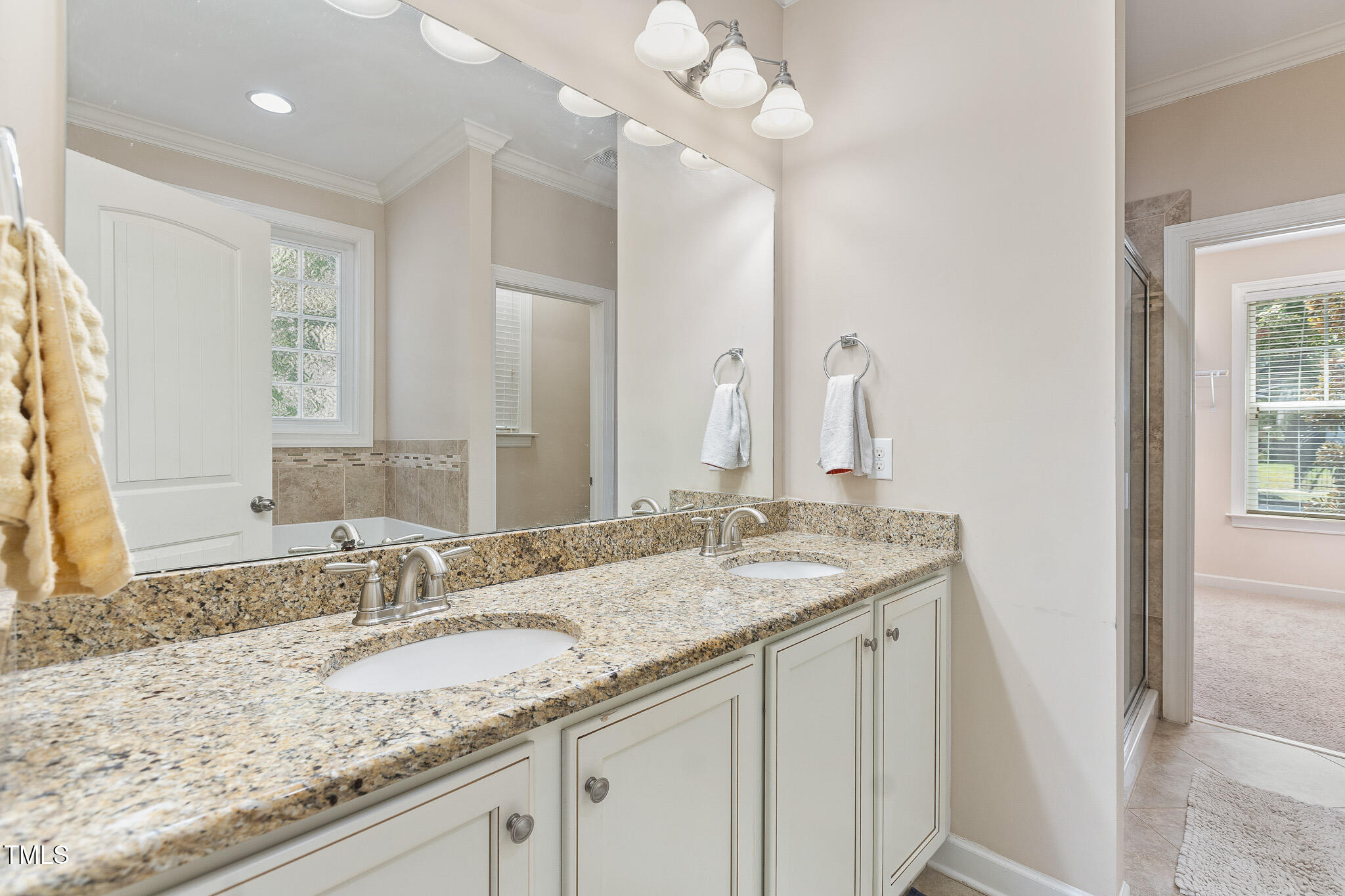 800 Chapanoke Road Raleigh, NC 27603 - Photo 16 of 39 a bathroom with a granite countertop double vanity sink and mirror