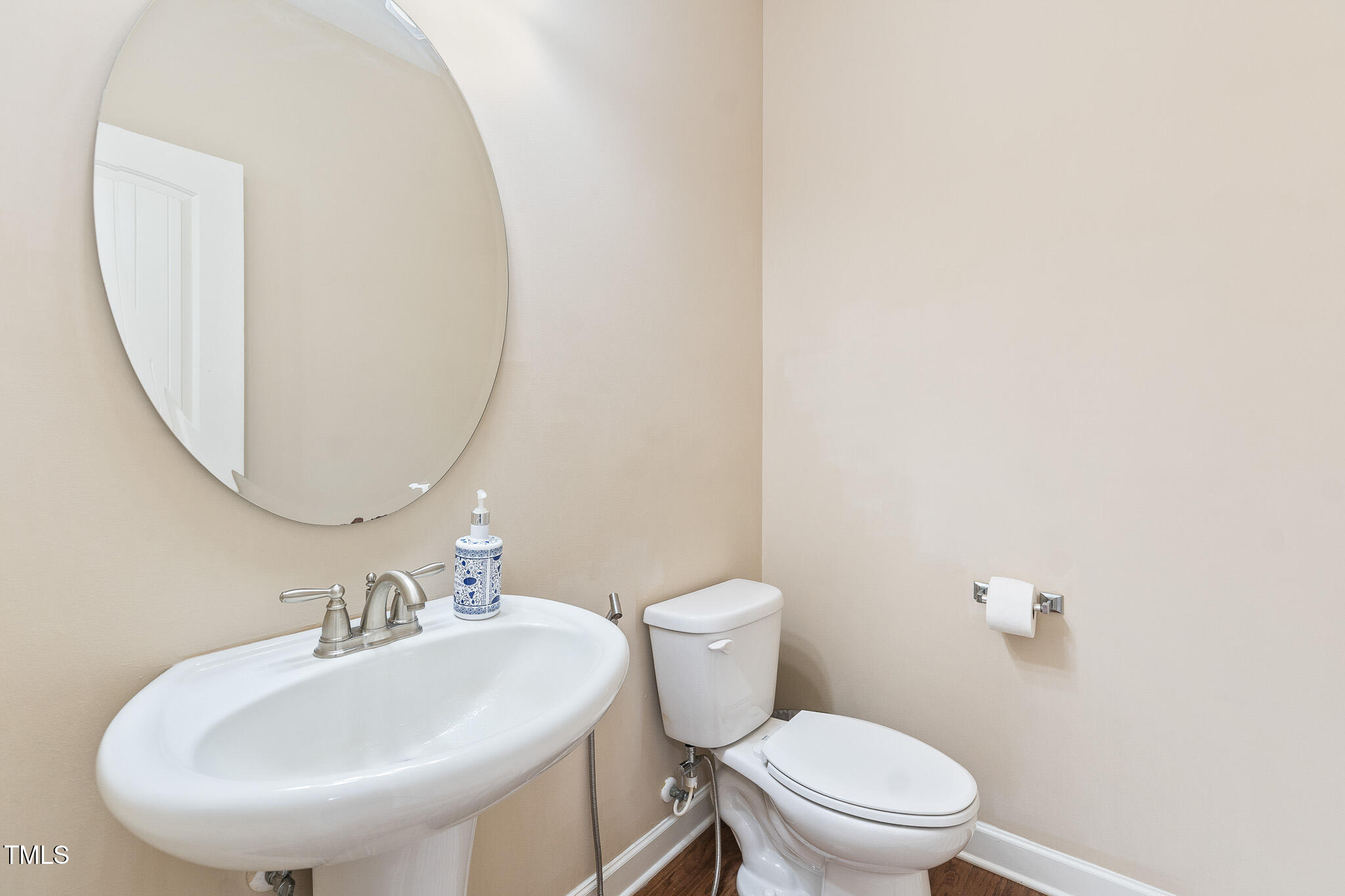 800 Chapanoke Road Raleigh, NC 27603 - Photo 20 of 39 a bathroom with a sink a mirror and a toilet