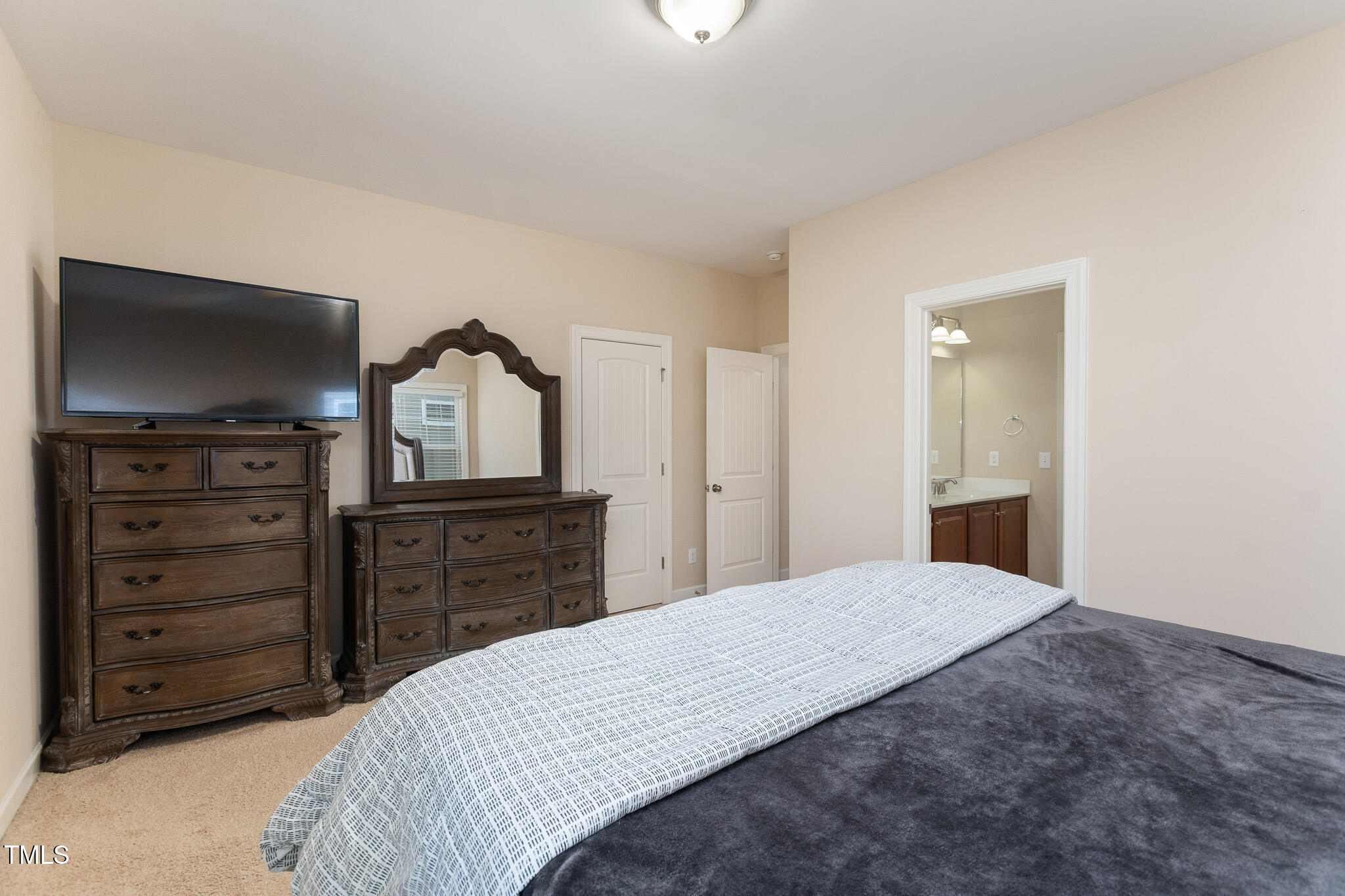 800 Chapanoke Road Raleigh, NC 27603 - Photo 28 of 39 a bedroom with a bed and a television