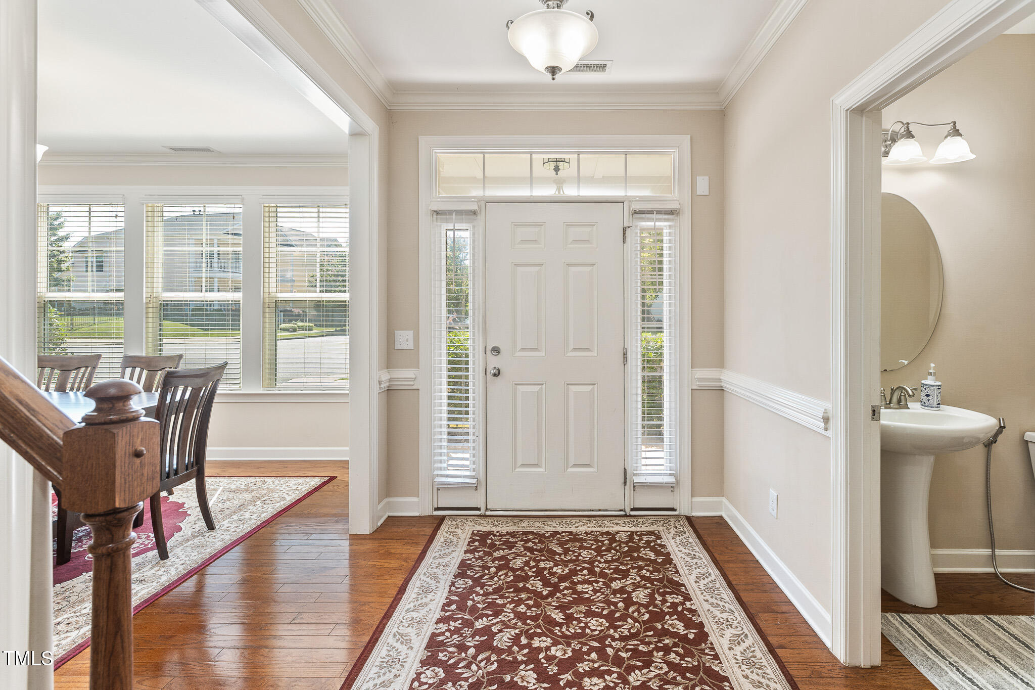 800 Chapanoke Road Raleigh, NC 27603 - Photo 4 of 39 a view of a hallway with wooden floor and windows