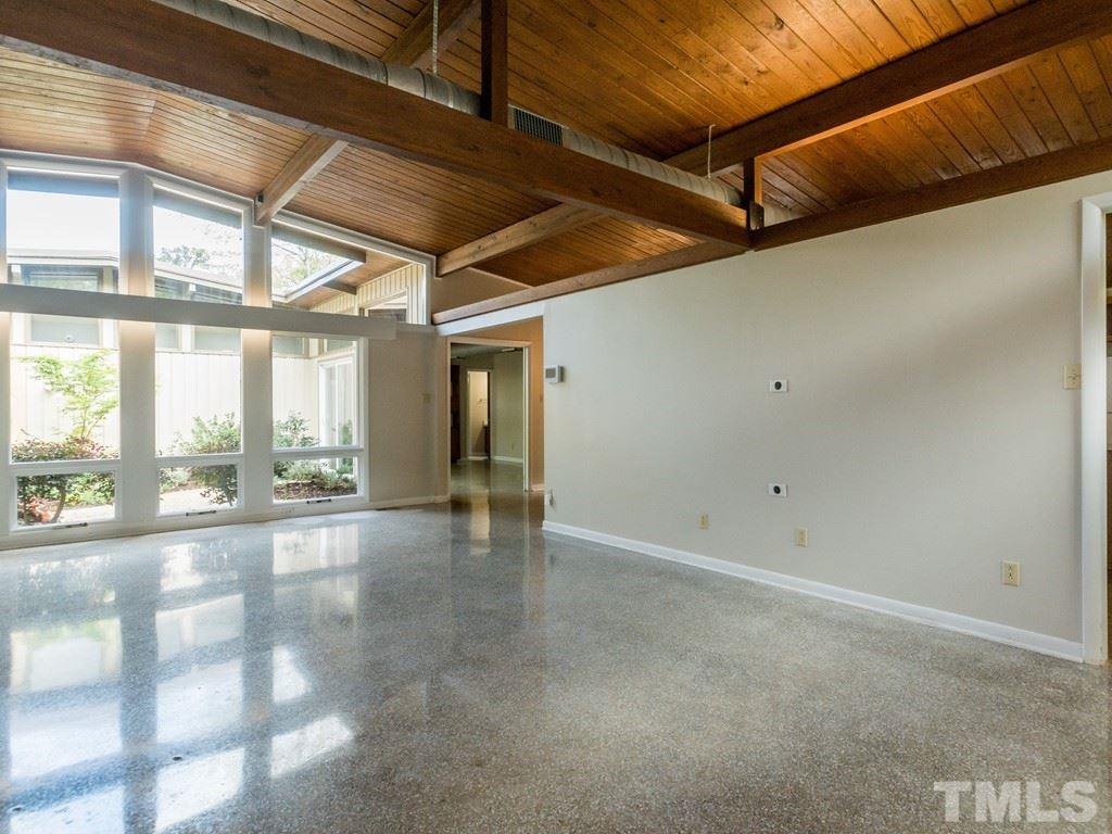 3612 Anclote Place Raleigh, NC 27607 - Photo 4 of 25 a view of an empty room with a large window