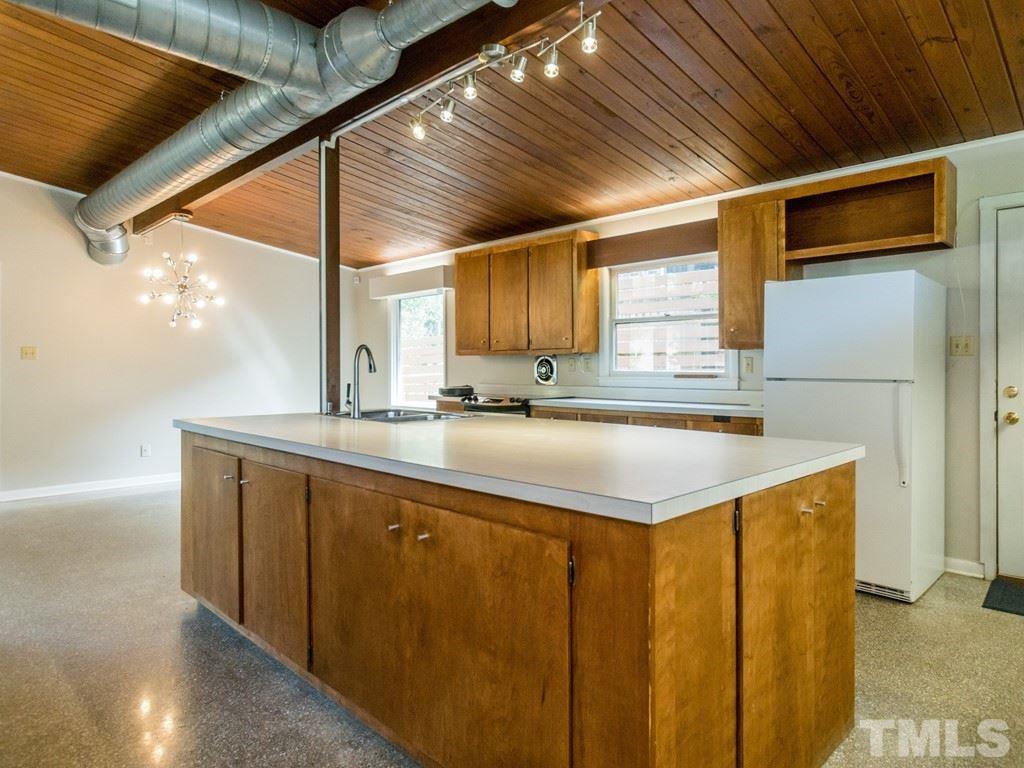 3612 Anclote Place Raleigh, NC 27607 - Photo 8 of 25 a kitchen with a sink a refrigerator and window