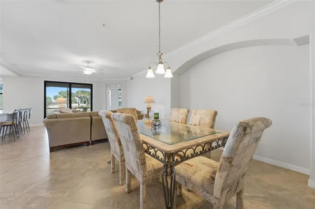 a view of a swimming pool with a couches in a patio