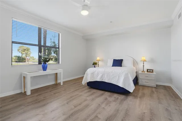 a view of a lake with houses in the back