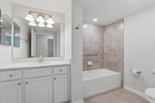 a view of a house with a yard and potted plants