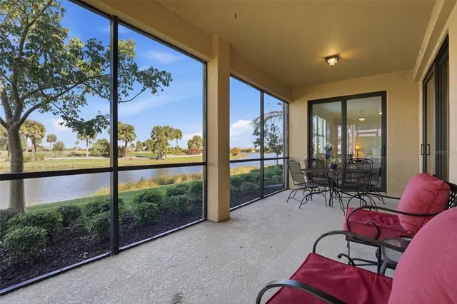 a row of palm trees and a swimming pool on a patio