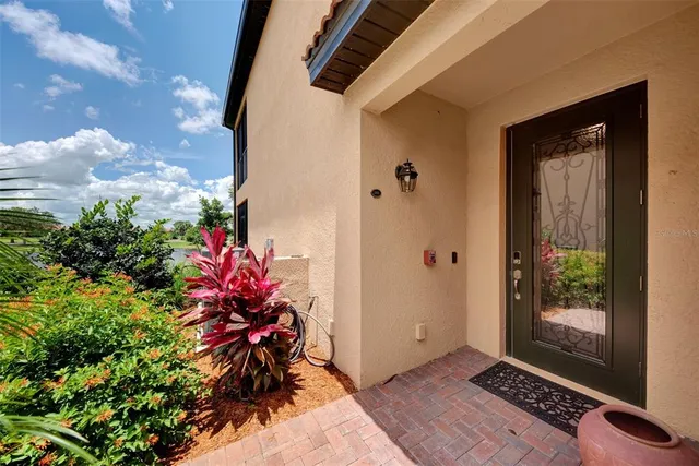 a kitchen with kitchen island granite countertop wooden cabinets and white stainless steel appliances